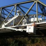 Highway bridge inspection, Under bridge maintenance, Railroad Snooper inspection truck.