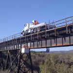 Highway bridge inspection, Under bridge maintenance, Railroad Snooper inspection truck.