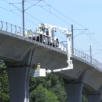 Highway bridge inspection, Under bridge maintenance, Railroad Snooper inspection truck.